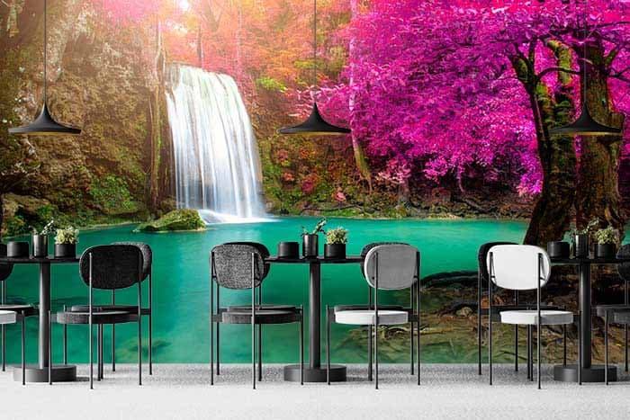 Serene Pink Trees and Waterfall Wallpaper shown in a room