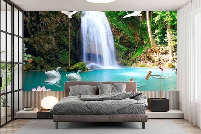 3D Mural Wallpaper of Waterfall With Beautiful Lotuses and Swans shown in a room