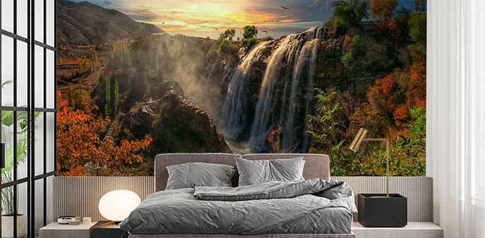 Serene Sunset and Waterfall Wallpaper Mural shown in a room