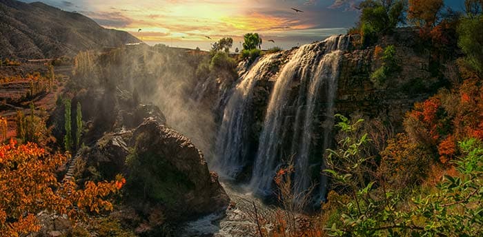Serene Sunset and Waterfall Wallpaper Mural pattern detail
