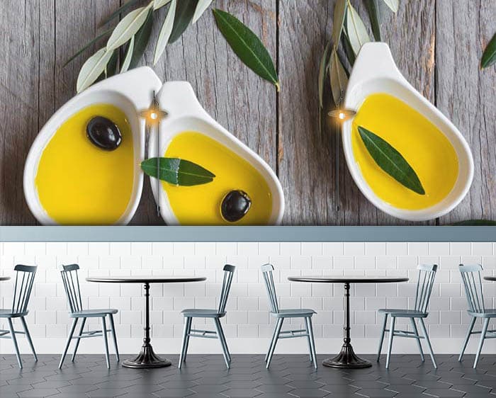olive oil in white ceramic pot shown in a room