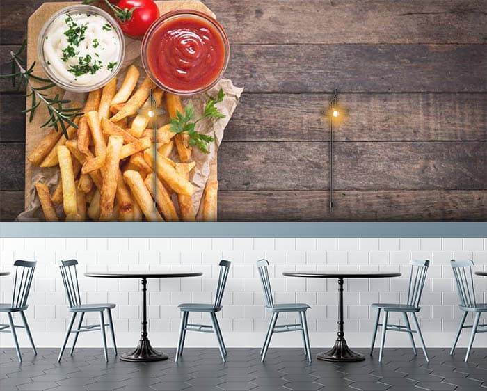 French fries and wooden table shown in a room