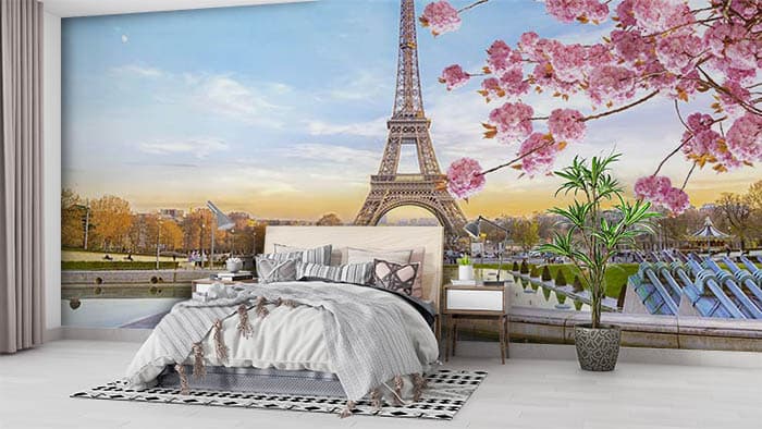 Elegant Pink Blossoms Around Eiffel Tower Wallpaper shown in a room