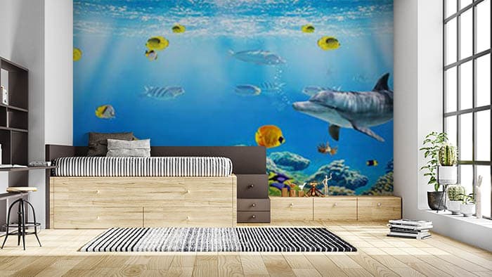 Fishes and Dolphins Ocean Wall Mural Wallpaper shown in a room