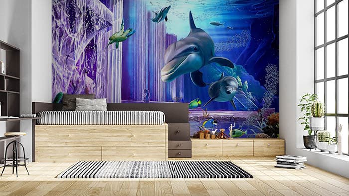 Dolphins Swimming Underwater Ocean Scene Wallpaper shown in a room