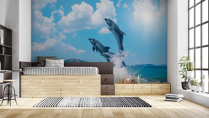 Jumping Dolphins Ocean View Wall Mural Wallpaper shown in a room