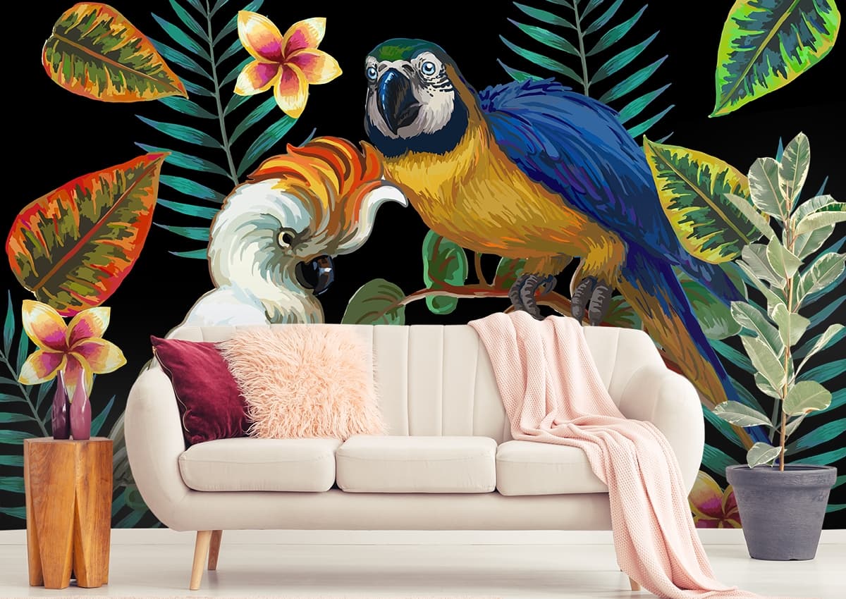 A parrots on a branch with leaves shown in a room