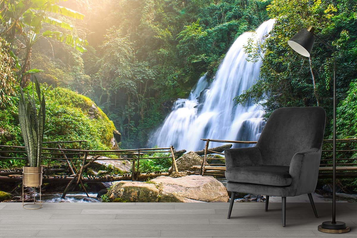 Serene waterfall flowing deep in woods nature wallpaper shown in a room