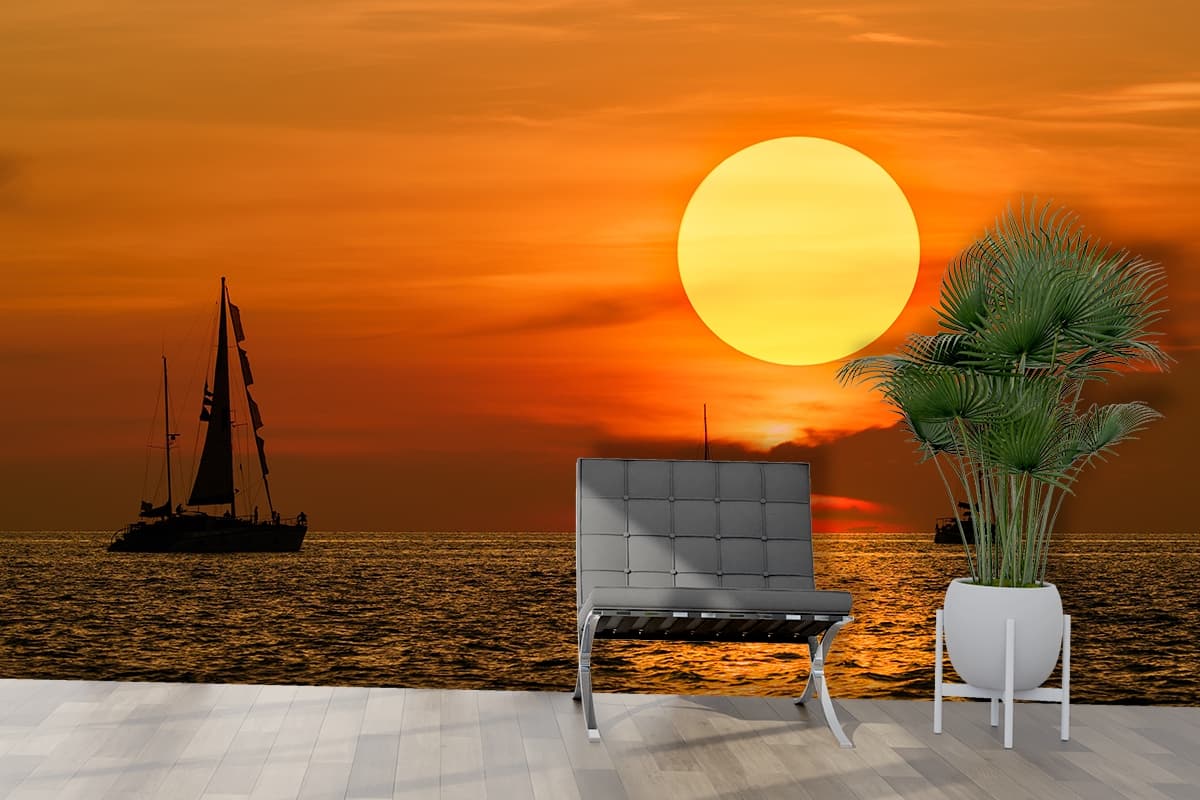 Golden Sunset Sailboats Scenic Ocean View Wallpaper shown in a room