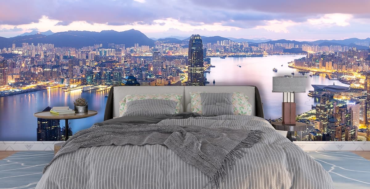 City skyline meeting water in peaceful evening light wallpaper shown in a room