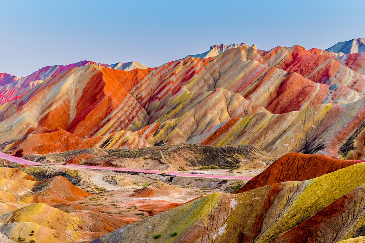 A colorful mountains with a road pattern detail