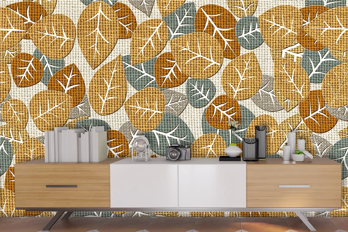 A pattern of leaves on a fabric surface shown in a room