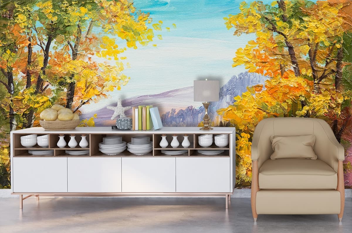 A painting of a lake with trees and mountains shown in a room