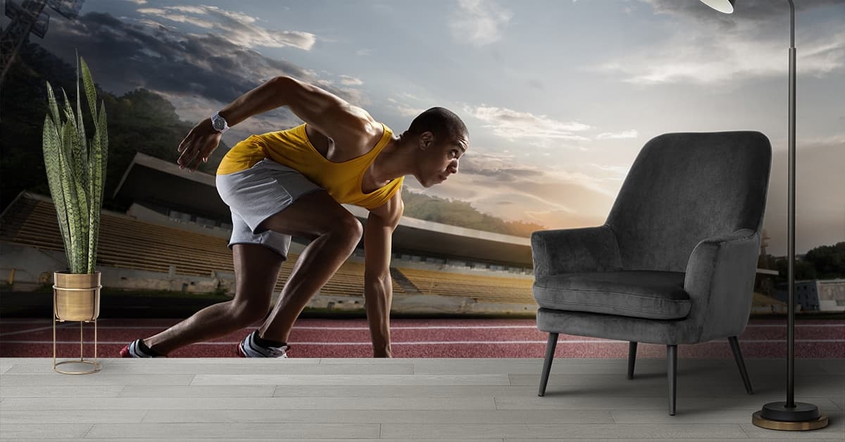 Man on Track Running Sports Scene wallpaper shown in a room
