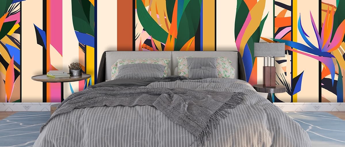 A colorful flower with leaves shown in a room
