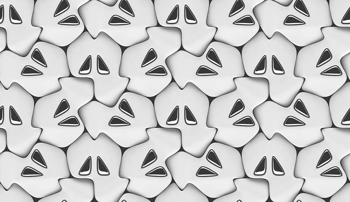 A group of white shapes with black eyes pattern detail