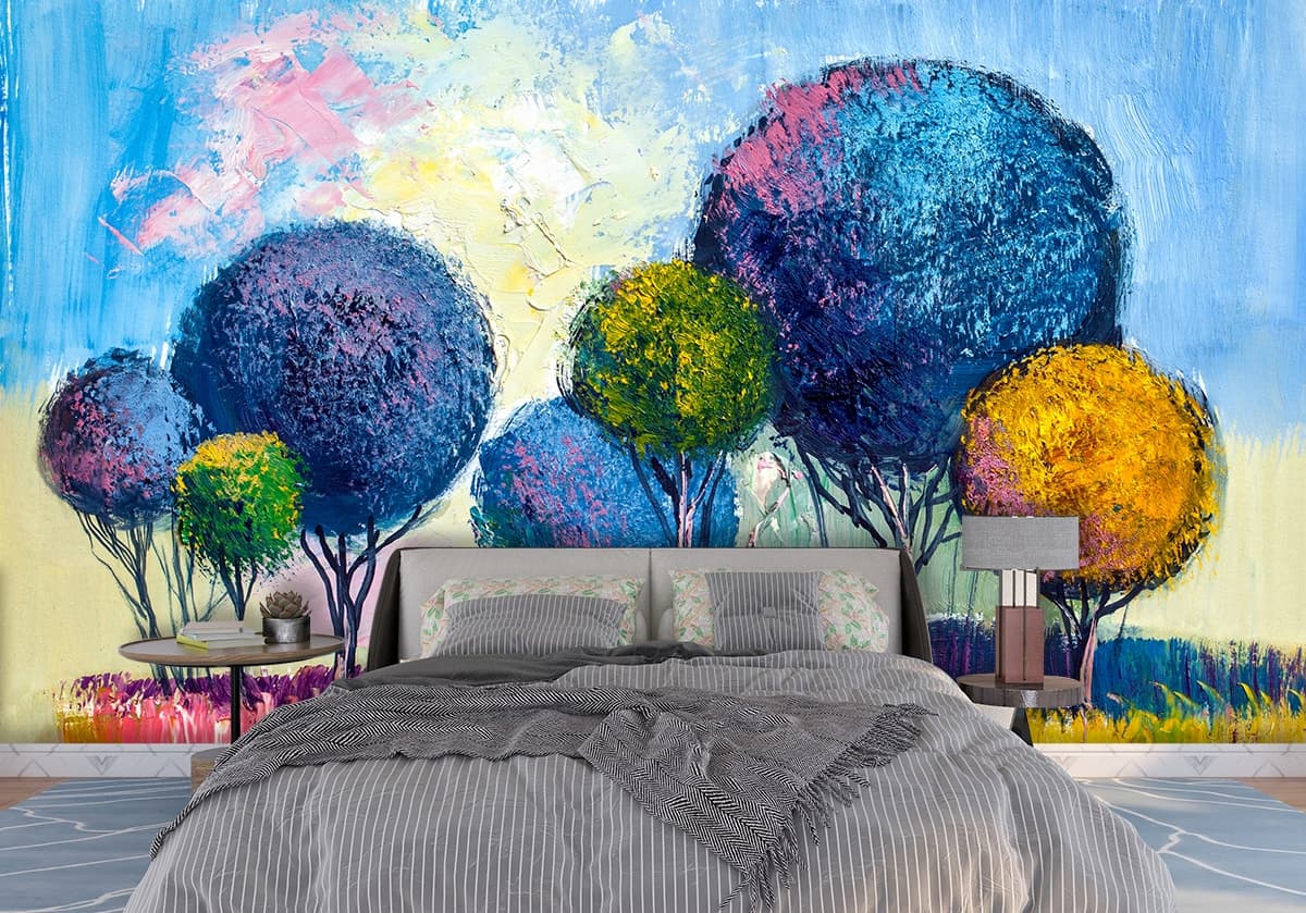 A painting of trees in a field shown in a room