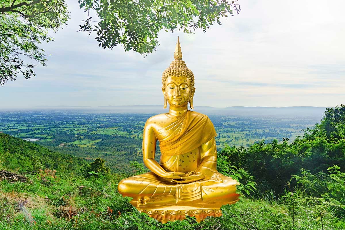 A golden statue of a person sitting on a hill pattern detail