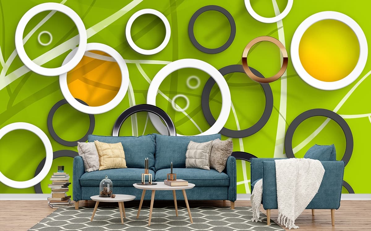 A group of rings on a green surface shown in a room