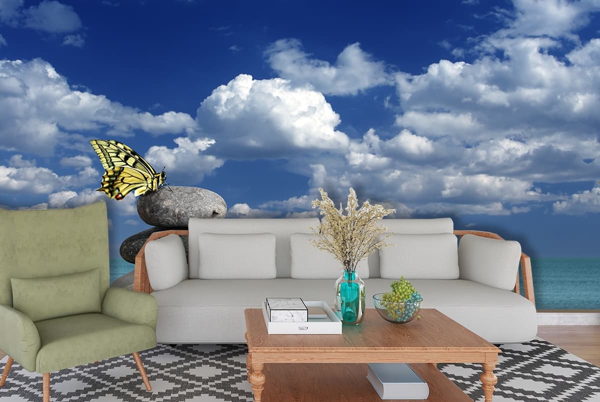 Peaceful Beach Stacked Rocks and Sky Blue Wallpaper shown in a room