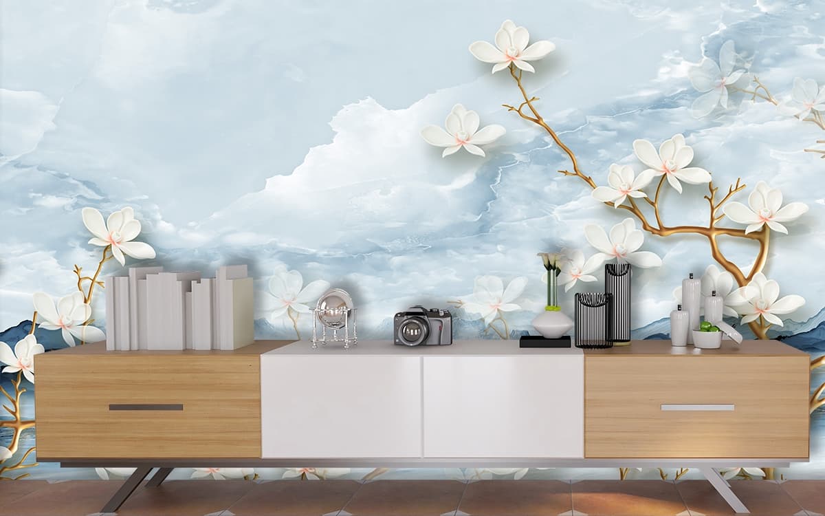 A white flowers on a branch shown in a room