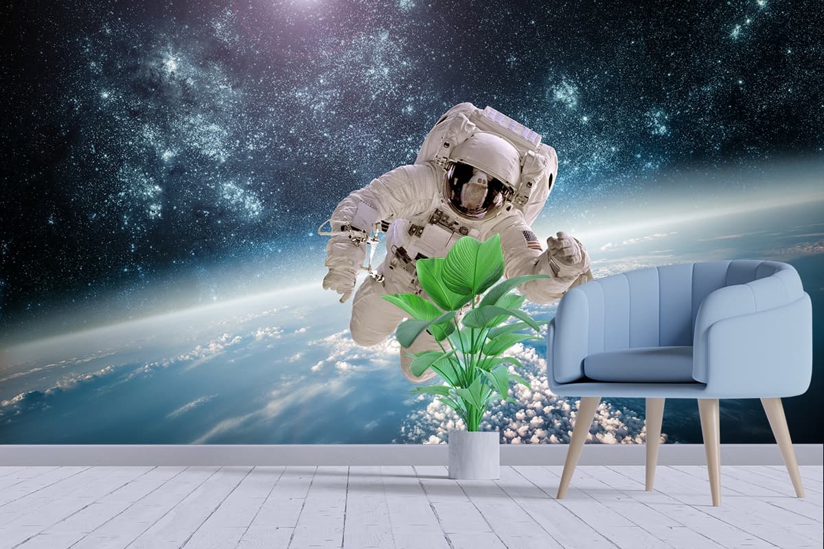 3D Astronaut Above Earth Cosmic Style Wallpaper shown in a room