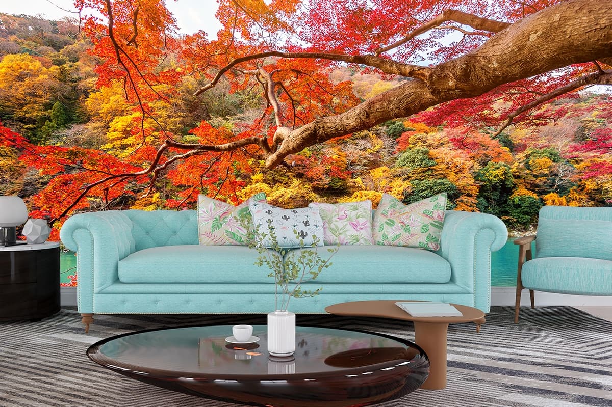 Colorful autumn trees around lake with boat scene wallpaper shown in a room