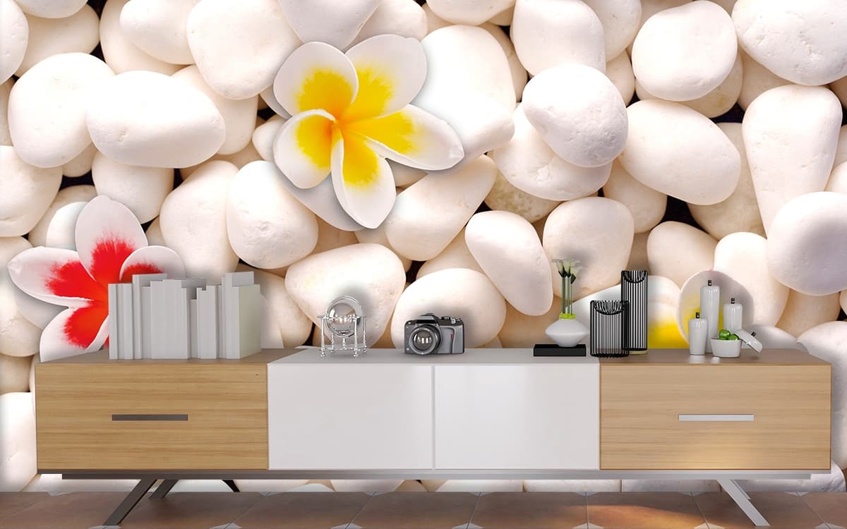 White rocks with flowers on them shown in a room