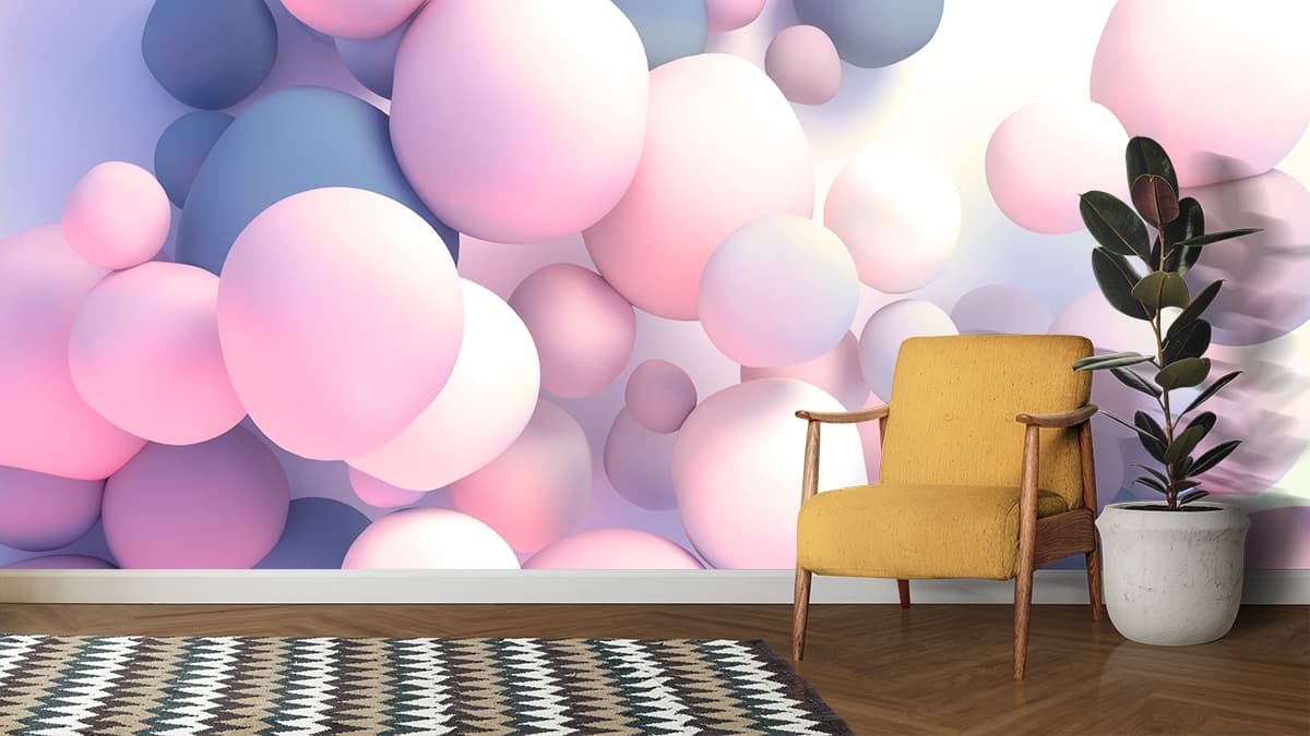A group of pink and blue balls shown in a room