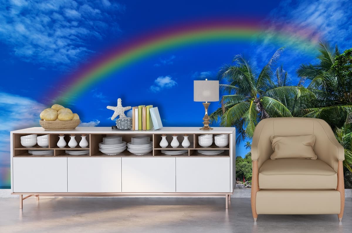 A rainbow over a beach shown in a room
