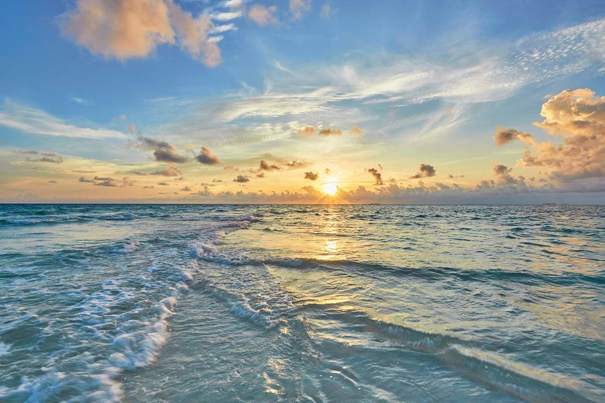Vibrant Sunset Over the Ocean Waves wallpaper pattern detail