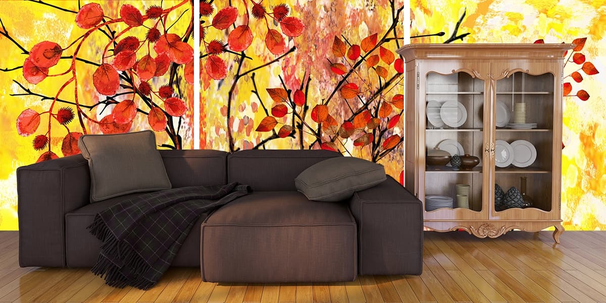 A tree with red leaves shown in a room