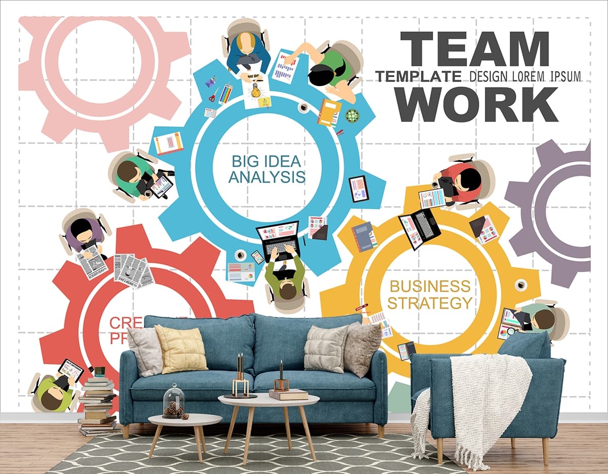 A group of people sitting at a table with gears shown in a room