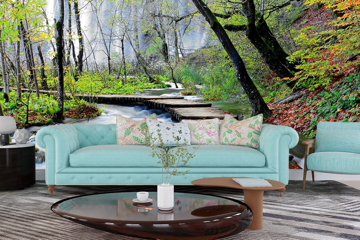 Rustic walkway over flowing river in nature wallpaper shown in a room