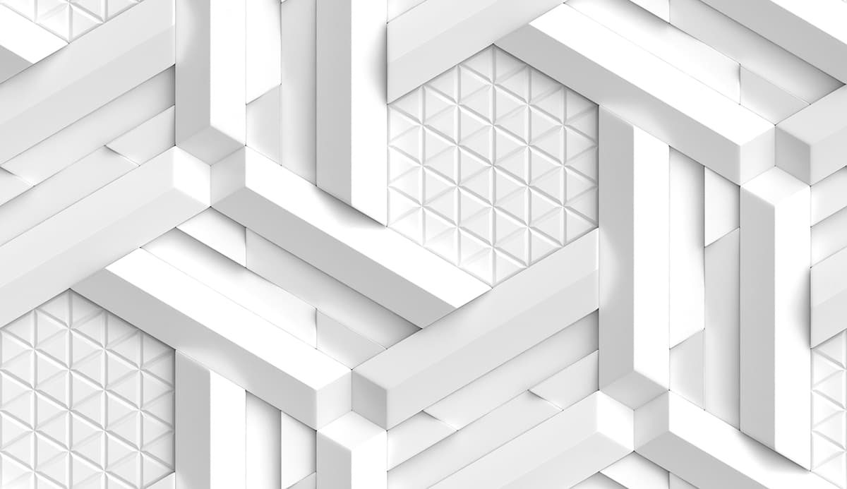 A white wall with many white cubes pattern detail