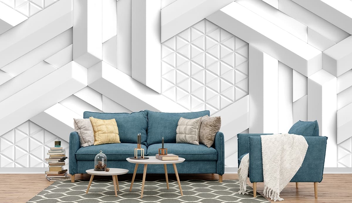 A white wall with many white cubes shown in a room