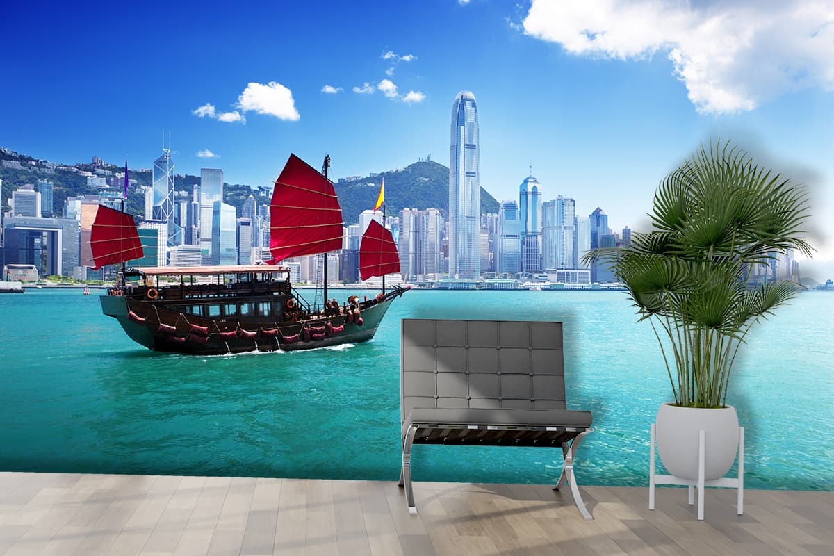 Iconic red sail junk boat in city harbour view wallpaper shown in a room