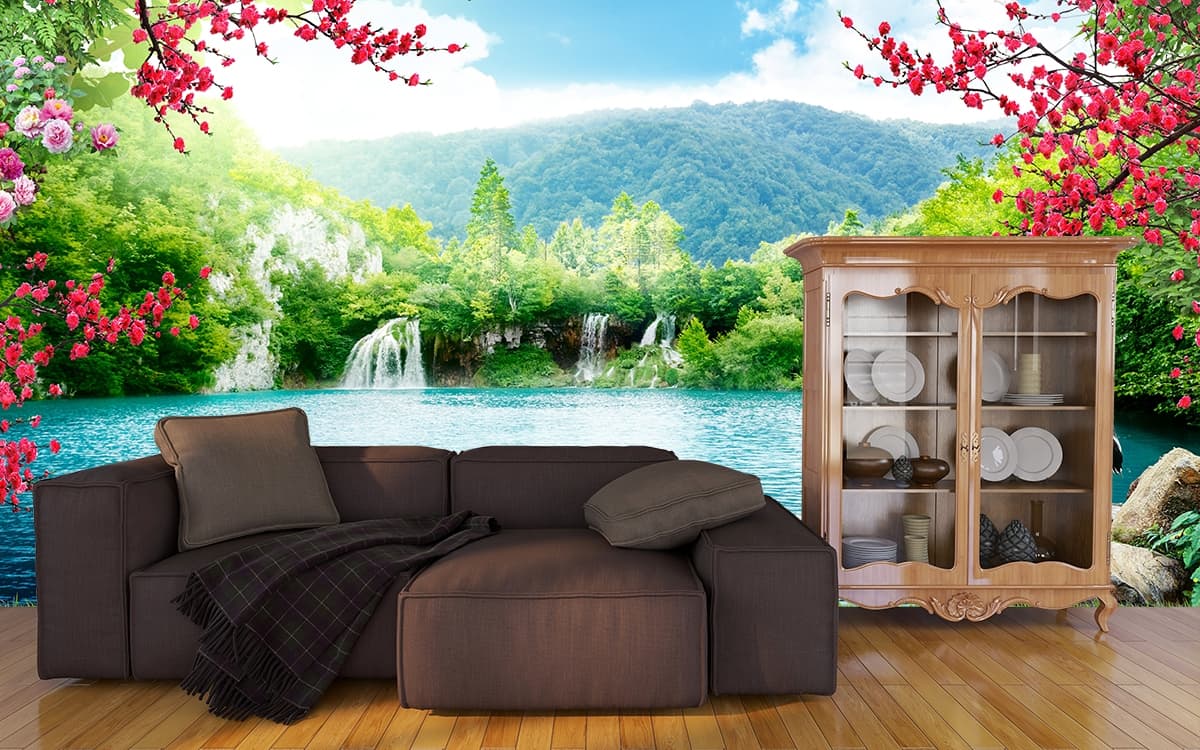 Elegant swans swimming on serene lake surface wallpaper shown in a room