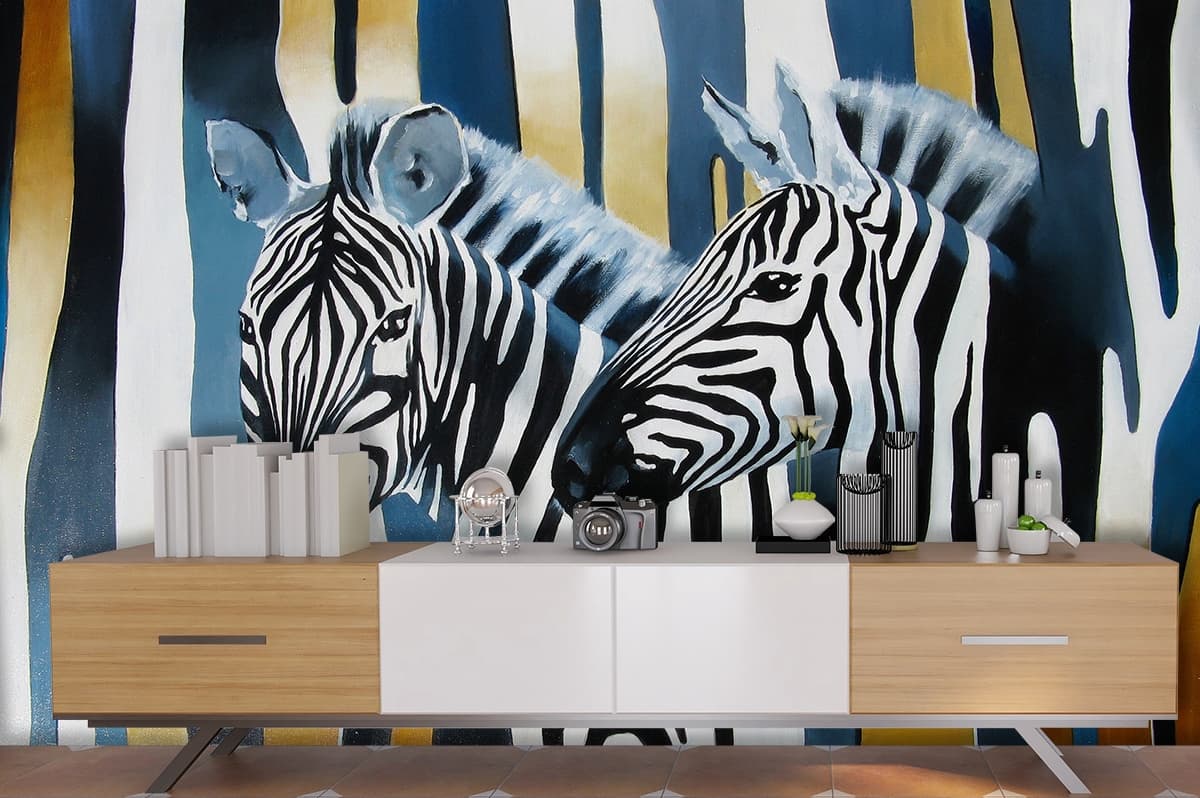 A painting of zebras in front of a blue and gold background shown in a room