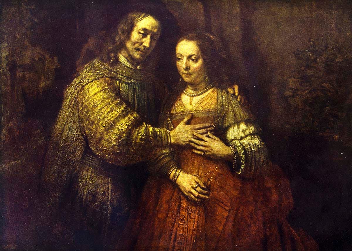 A man and woman in a gold dress pattern detail