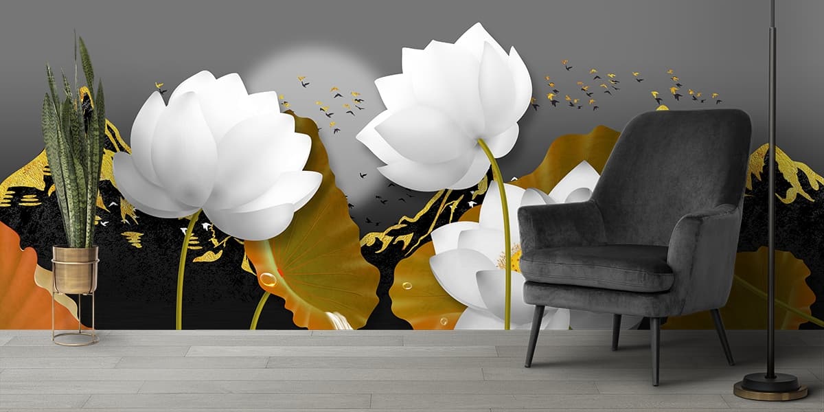 A white flowers with gold leaves shown in a room