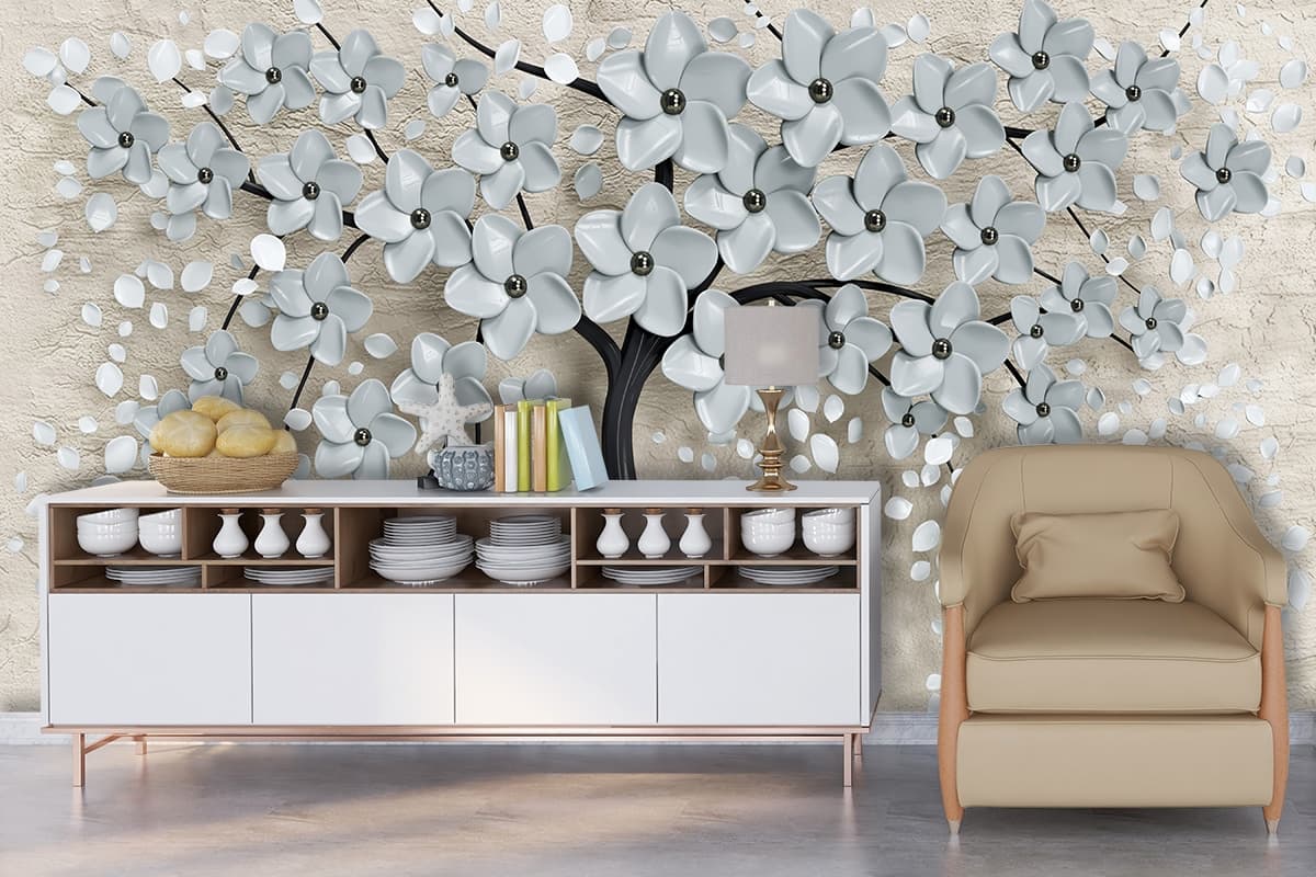 A tree with flowers and leaves shown in a room