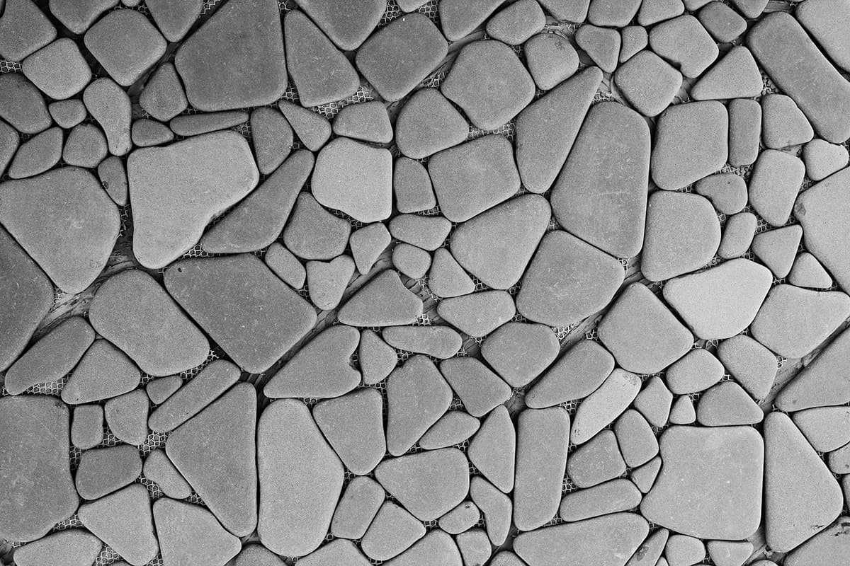 A close up of a stone floor pattern detail