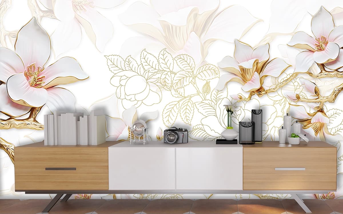A white flowers with gold outline on a white background shown in a room