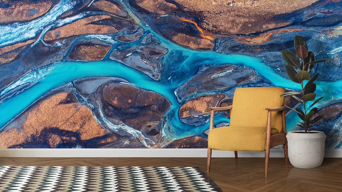 Beautiful River Flowing in Mountains Wallpaper shown in a room