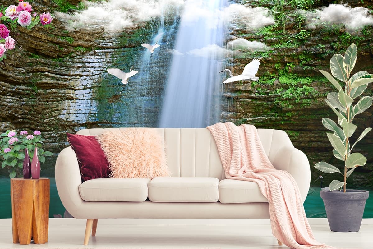 A waterfall with swans and flowers shown in a room