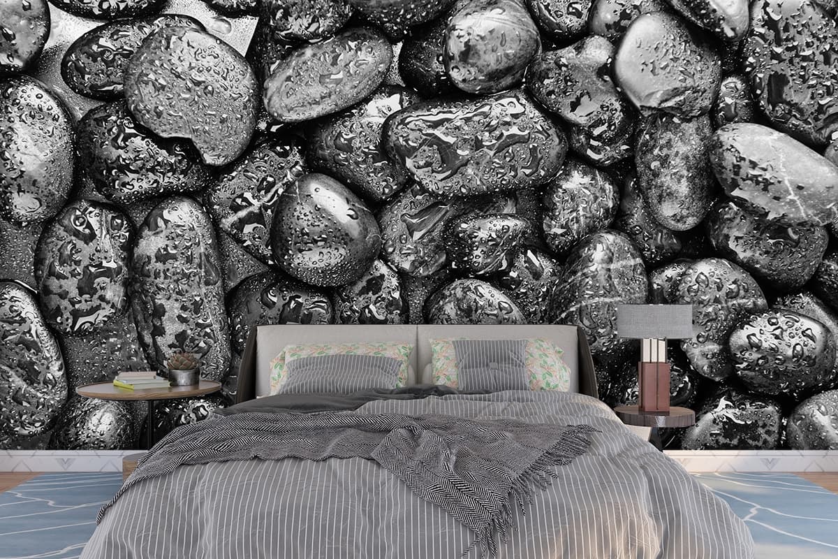 A group of wet rocks shown in a room