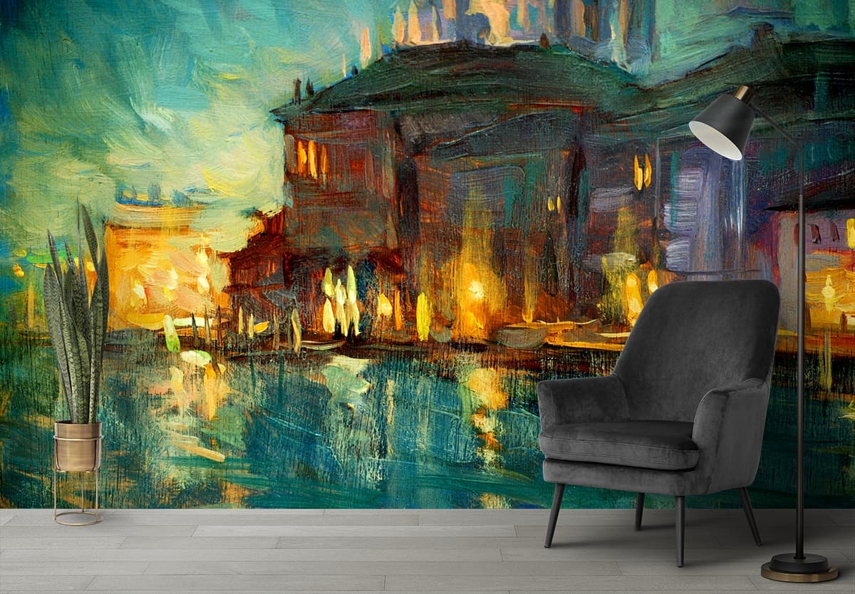 A painting of a building with lights on it shown in a room