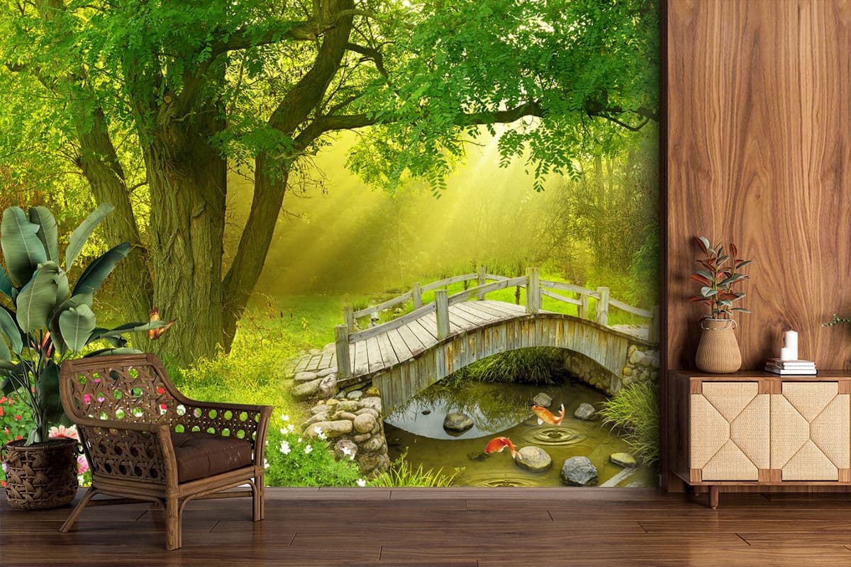 Wooden bridge above clear stream with fish below wallpaper shown in a room