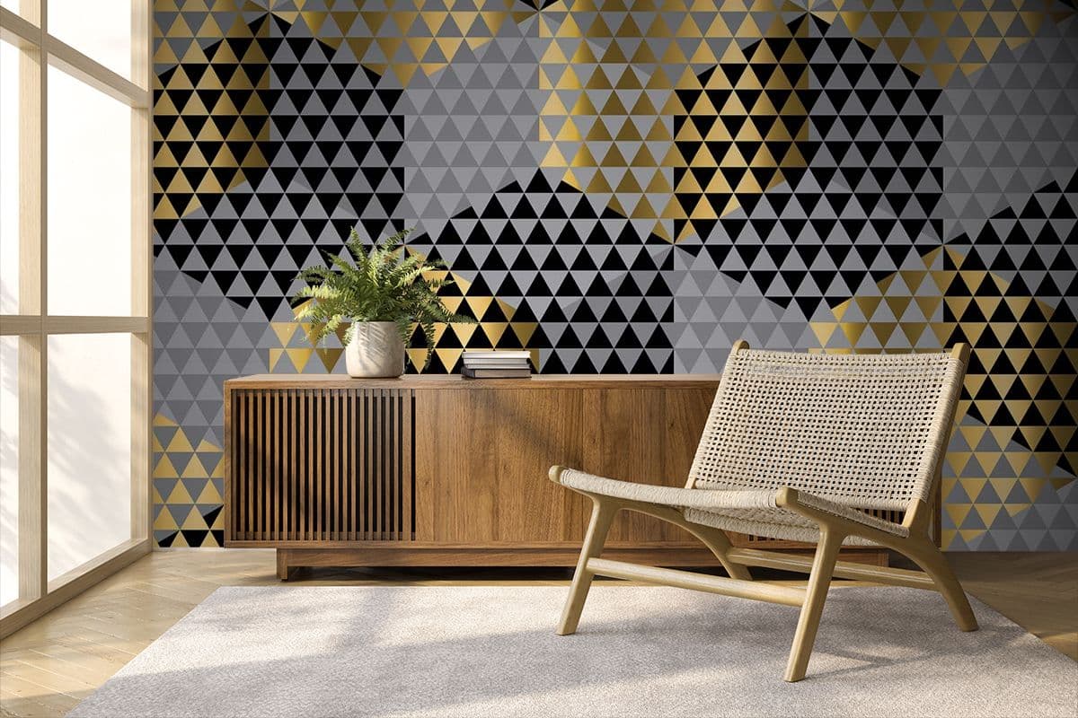 A Pattern of Black and Gold Triangles Geometric Luxury Wallpaper shown in a room